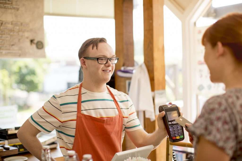 Man holding a credit card reader