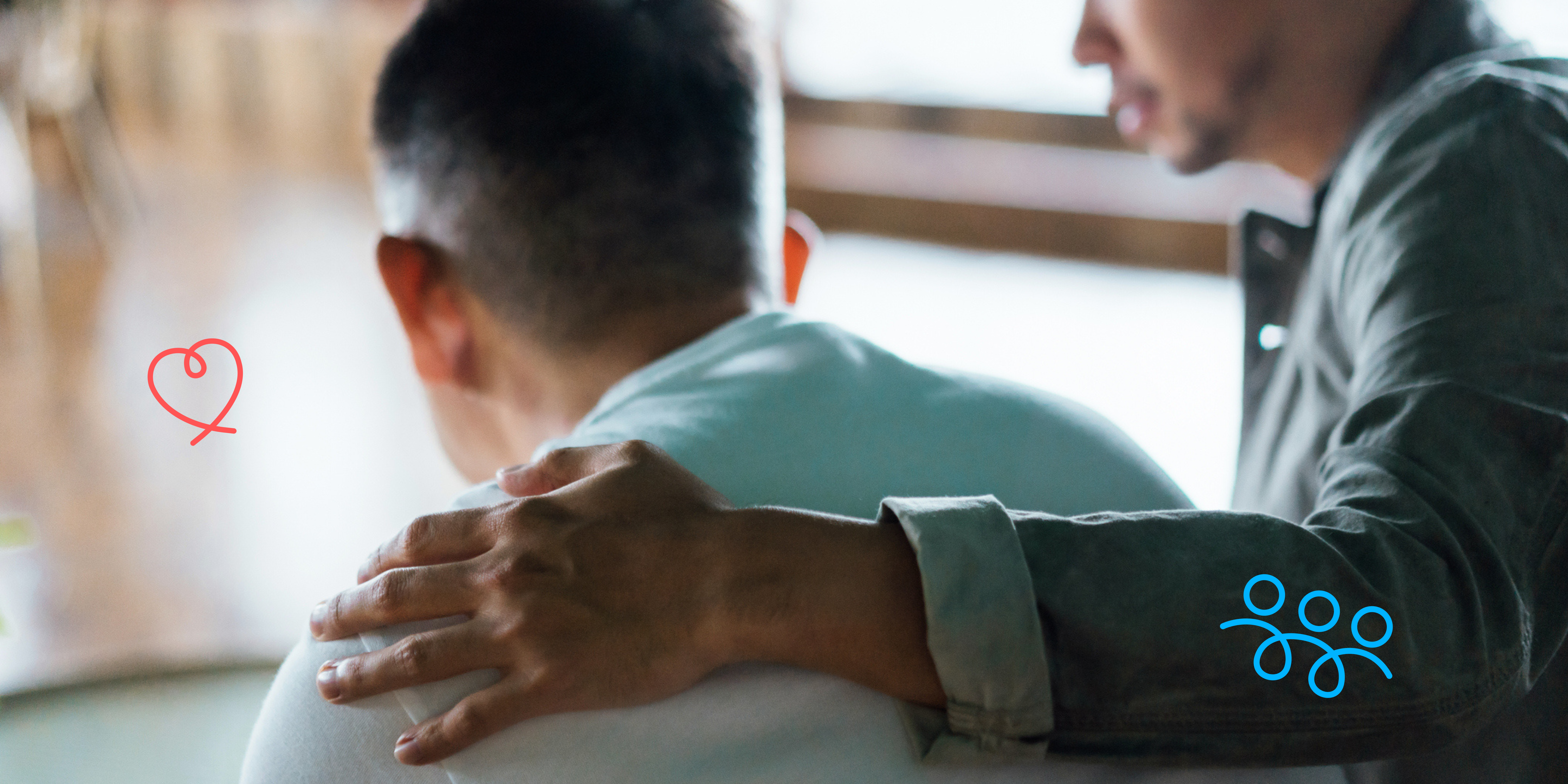 person consoling another person