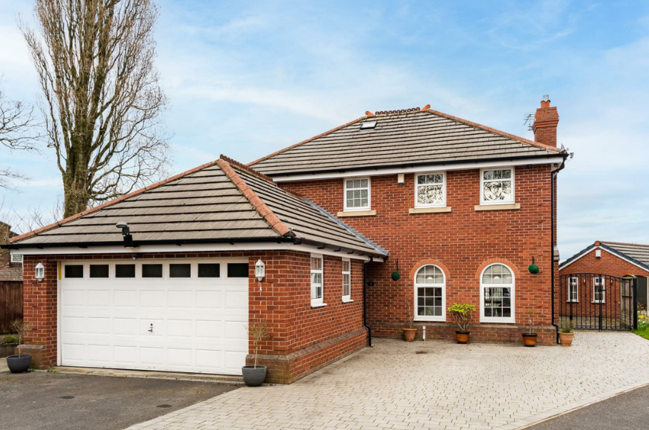 Outside of large detatched home with garage